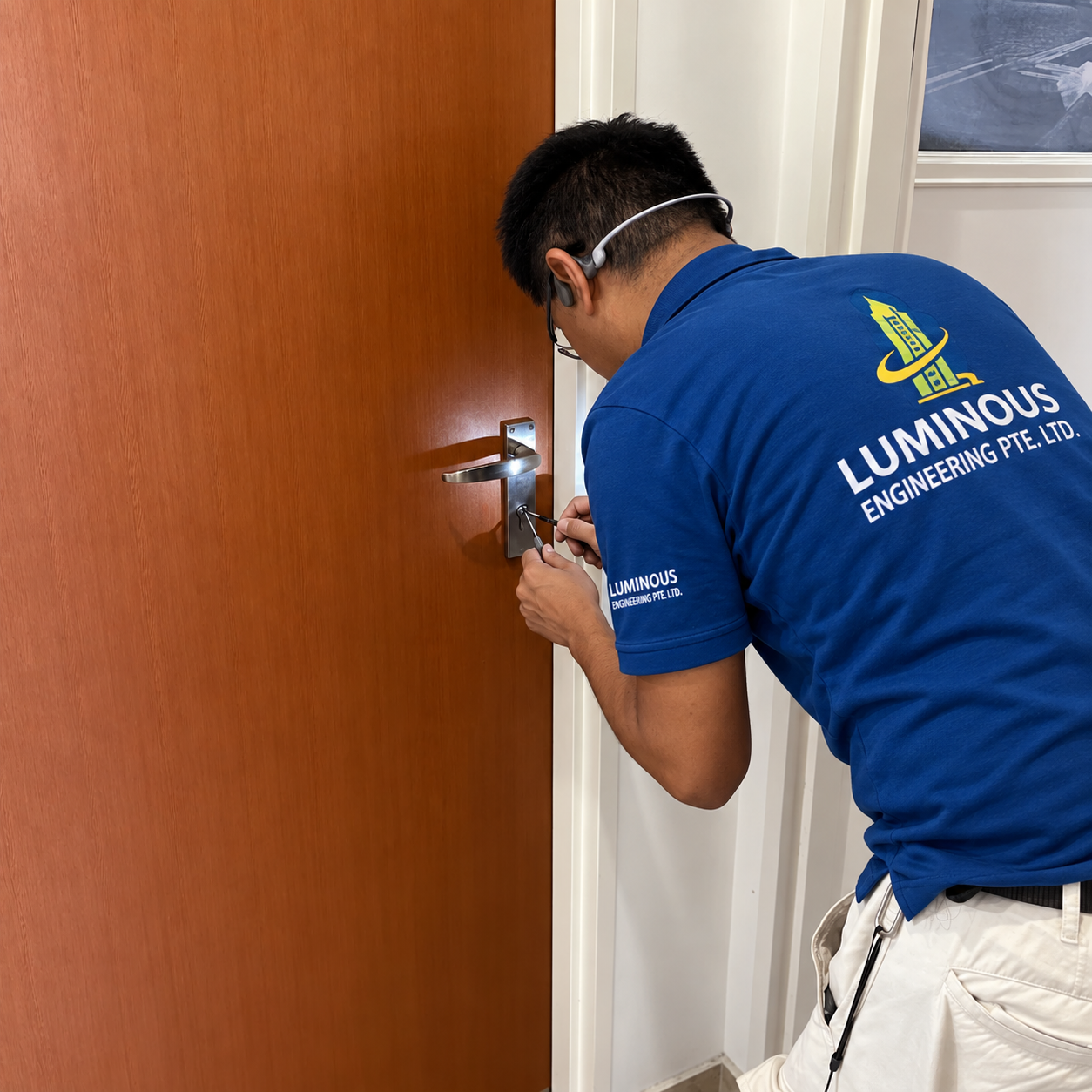 Handyman repairing a door in Singapore