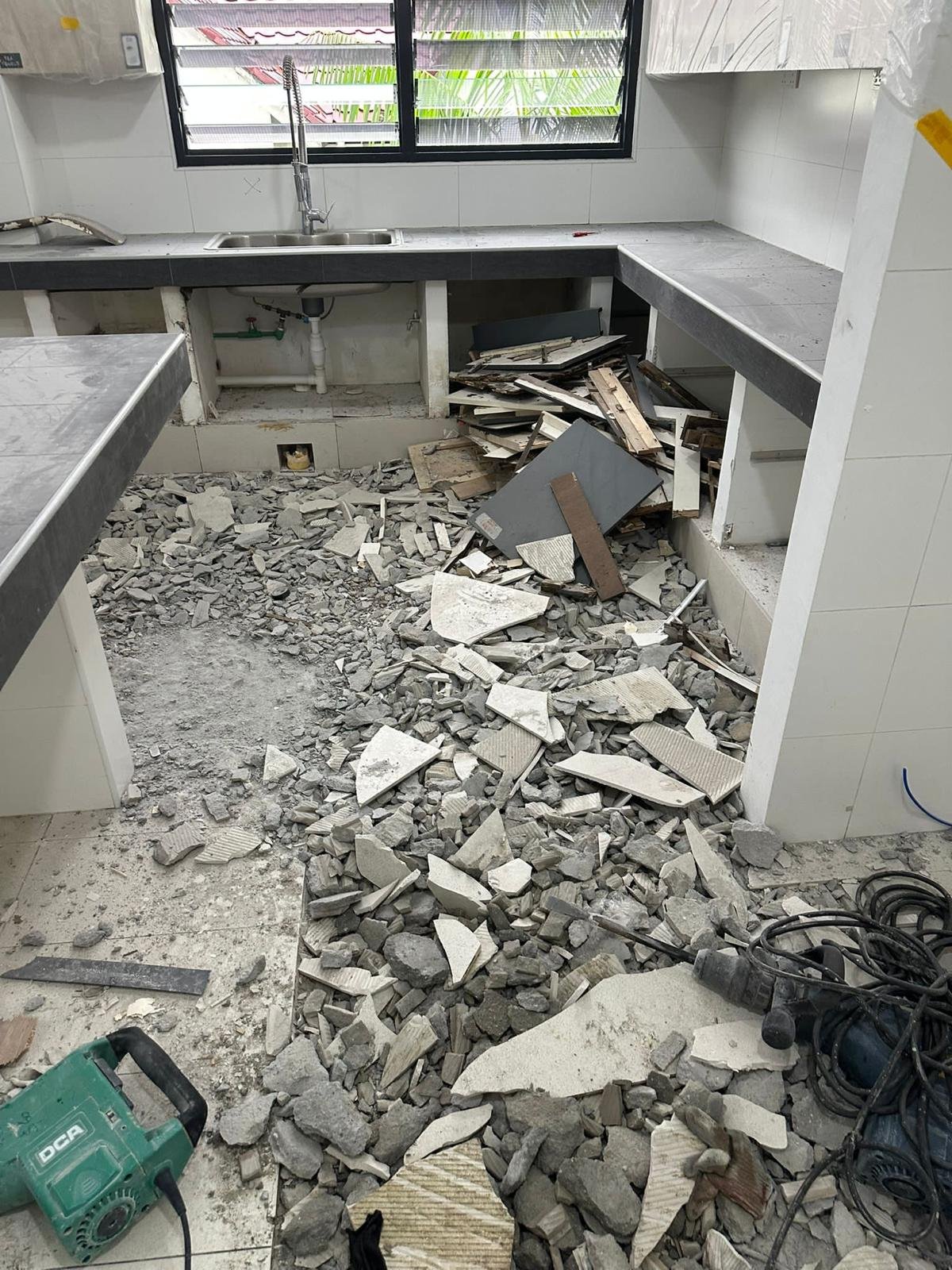 Handyman performing drilling and installation